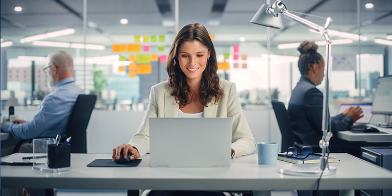 Woman using computer in Whitchurch office